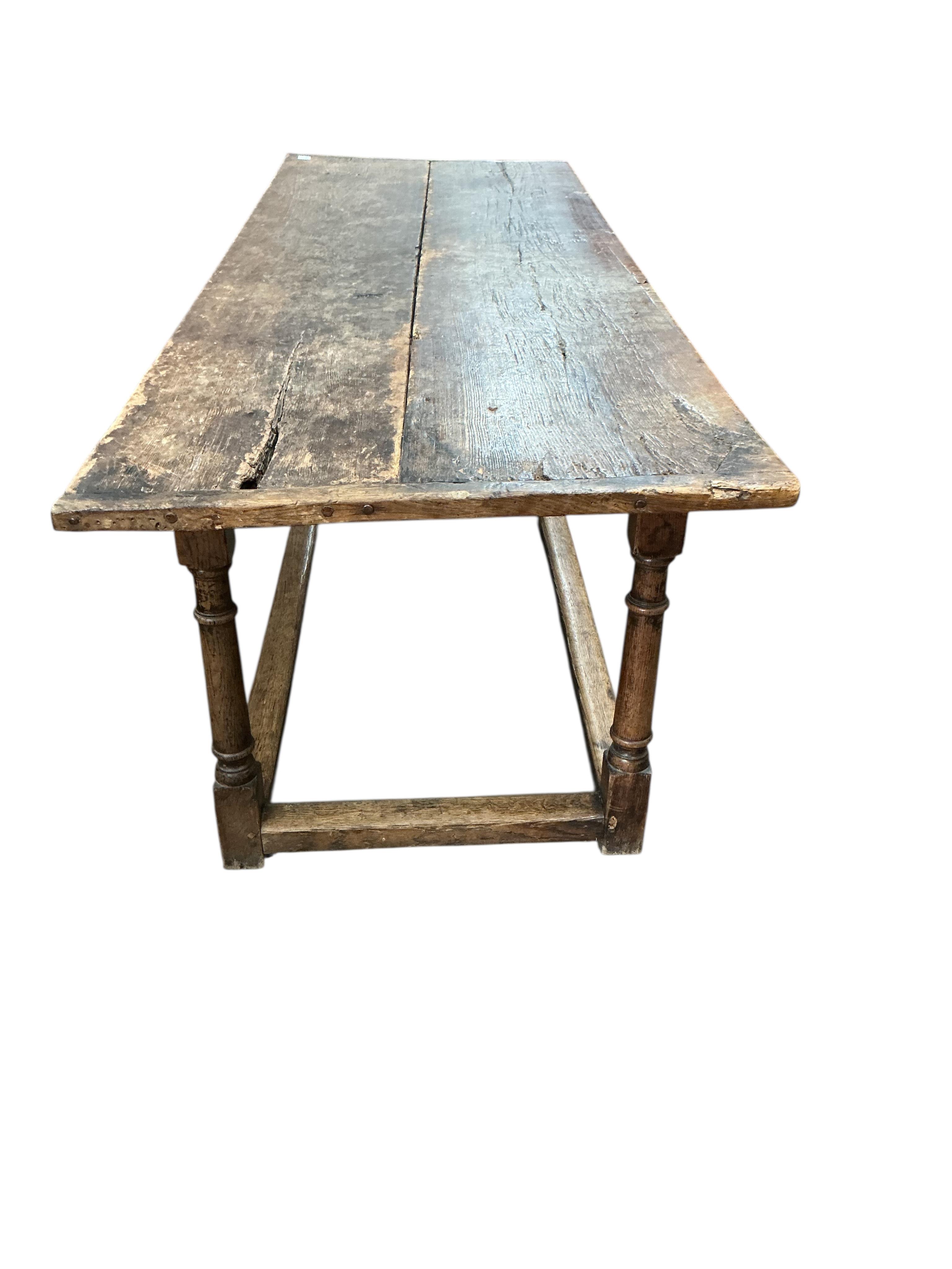 A 17th century and later rectangular oak refectory dining table, width 212cm, depth 75cm, height 77cm